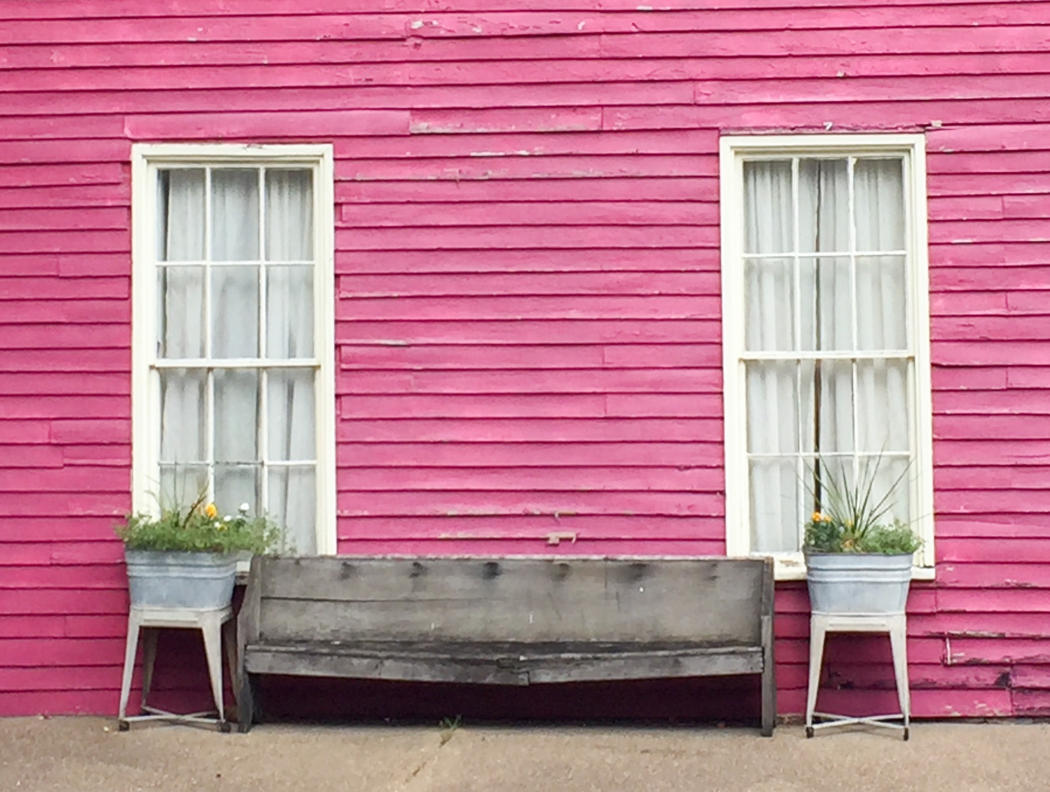 Pink house with bench