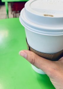 coffee cup on green table